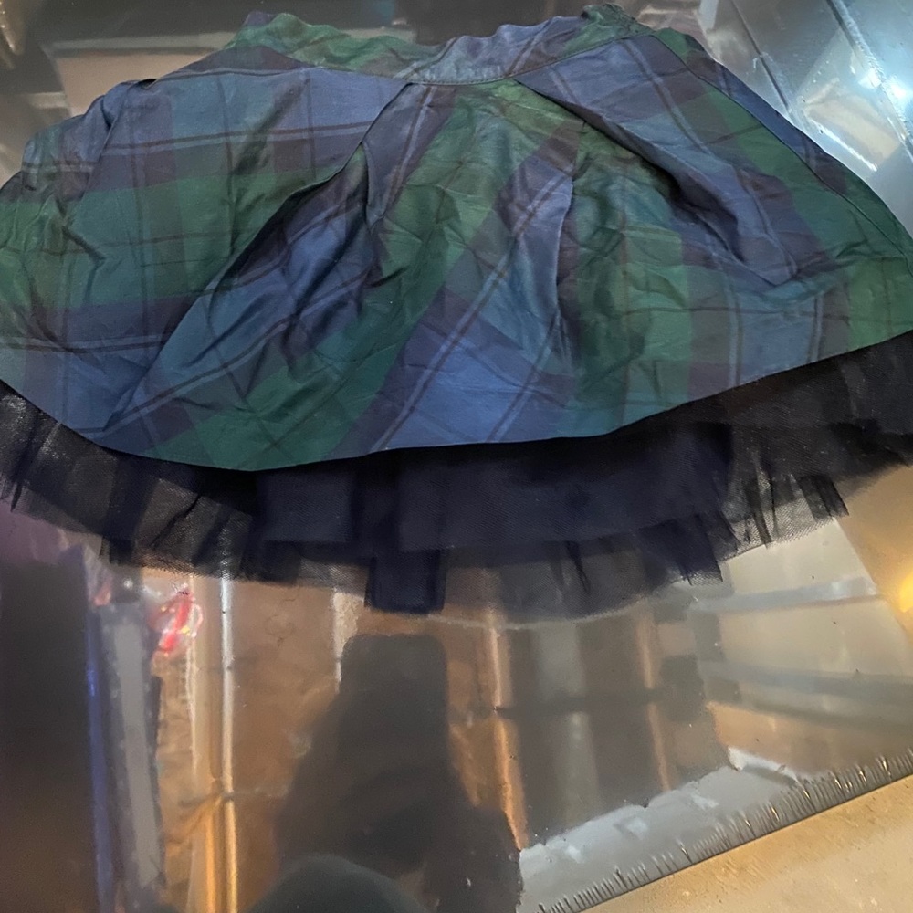 Girl blue and green skirt